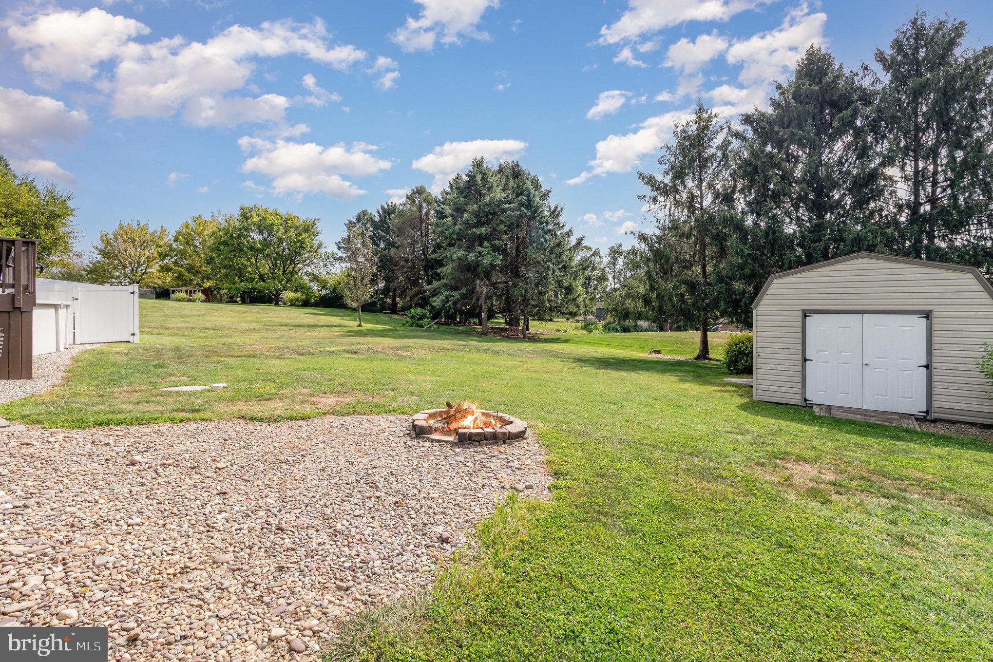 212 Weaver Drive Lititz, PA 17543 - Photo 38 of 44 a backyard of a house with a yard and outdoor seating