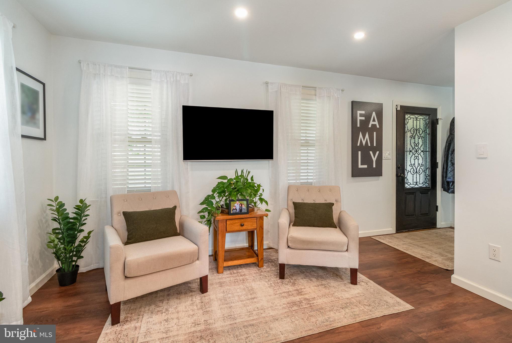 212 Weaver Drive Lititz, PA 17543 - Photo 5 of 44 a living room with furniture and a flat screen tv