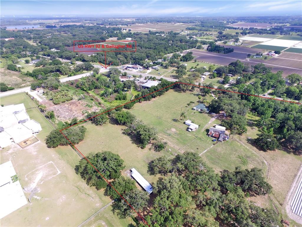 13030 Highway 92 Dover, FL 33527 - Photo 3 of 8 an aerial view of a house with a lake view