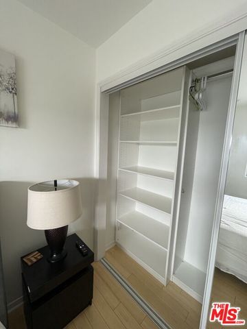 a bathroom with a mirror and a shower