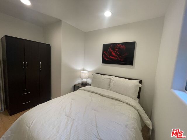 a bathroom with a shower and a sink