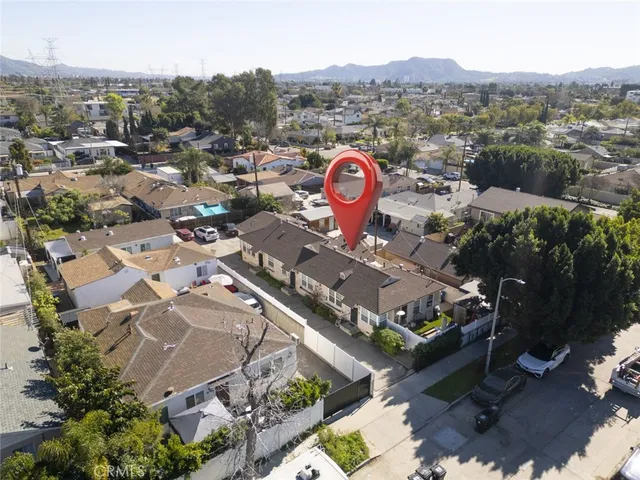 an aerial view of a house with a swimming pool