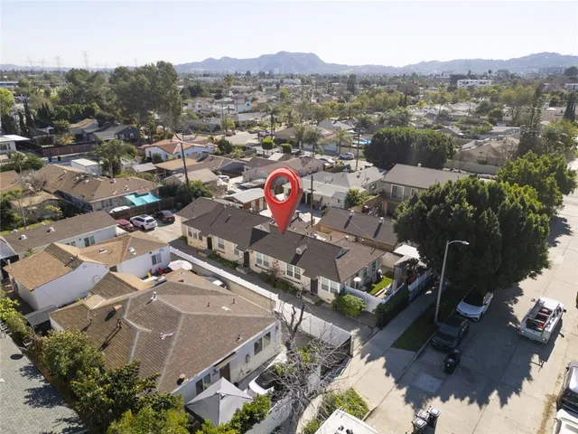 an aerial view of a town with couple of houses