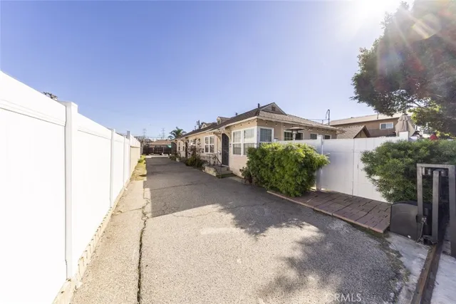 a view of a house with a yard and garage