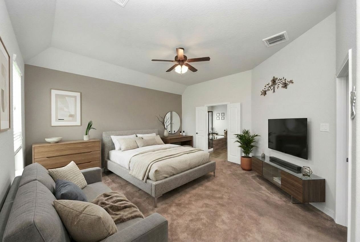 24503 Eucalyptus Way Spring, TX 77373 - Photo 6 of 27 a spacious bedroom with a bed and a flat screen tv