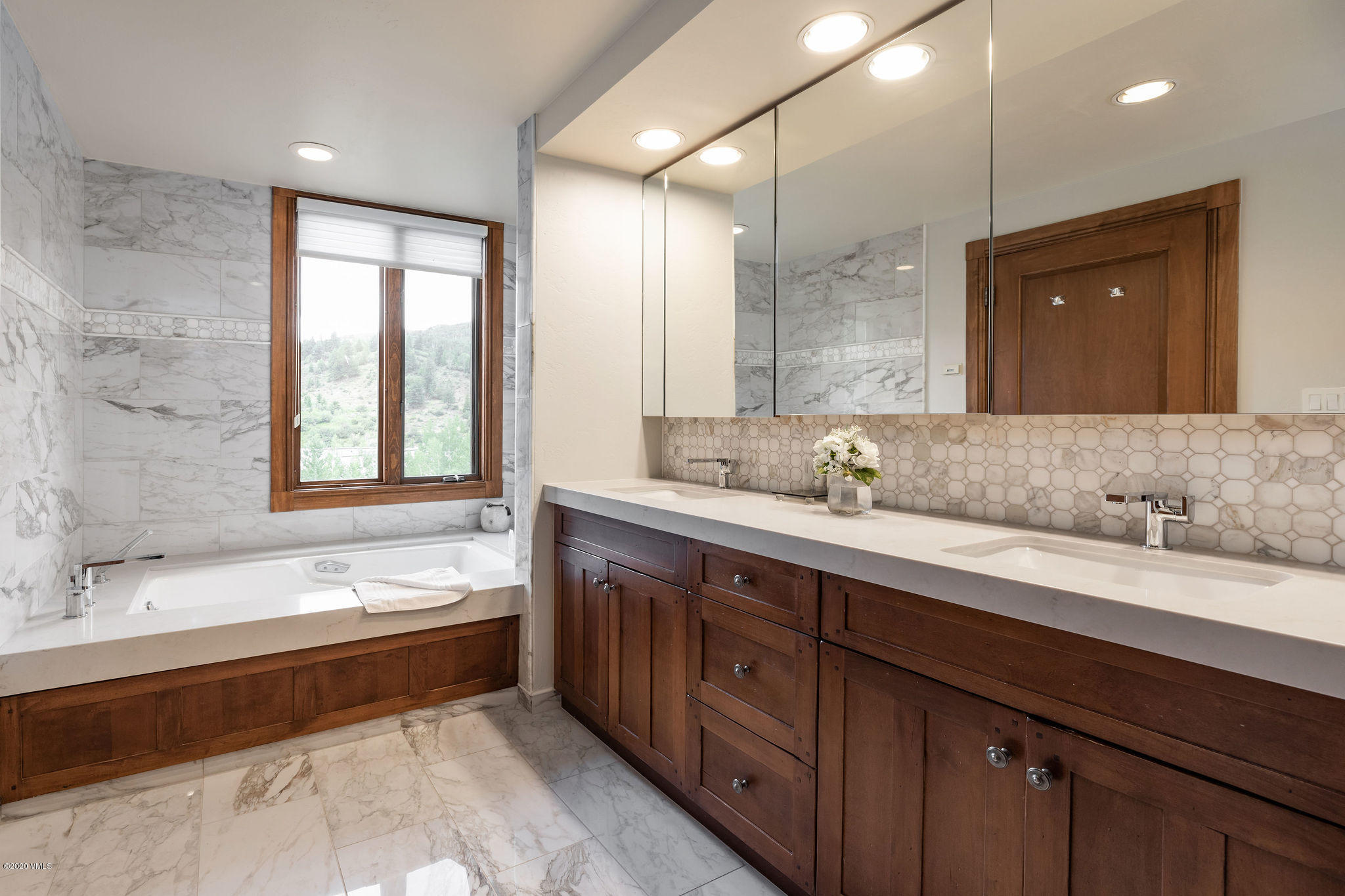 62 Highlands Lane, Unit R602 Beaver Creek, CO 81620 - Photo 14 of 30 a spacious bathroom with a large tub sink and mirror