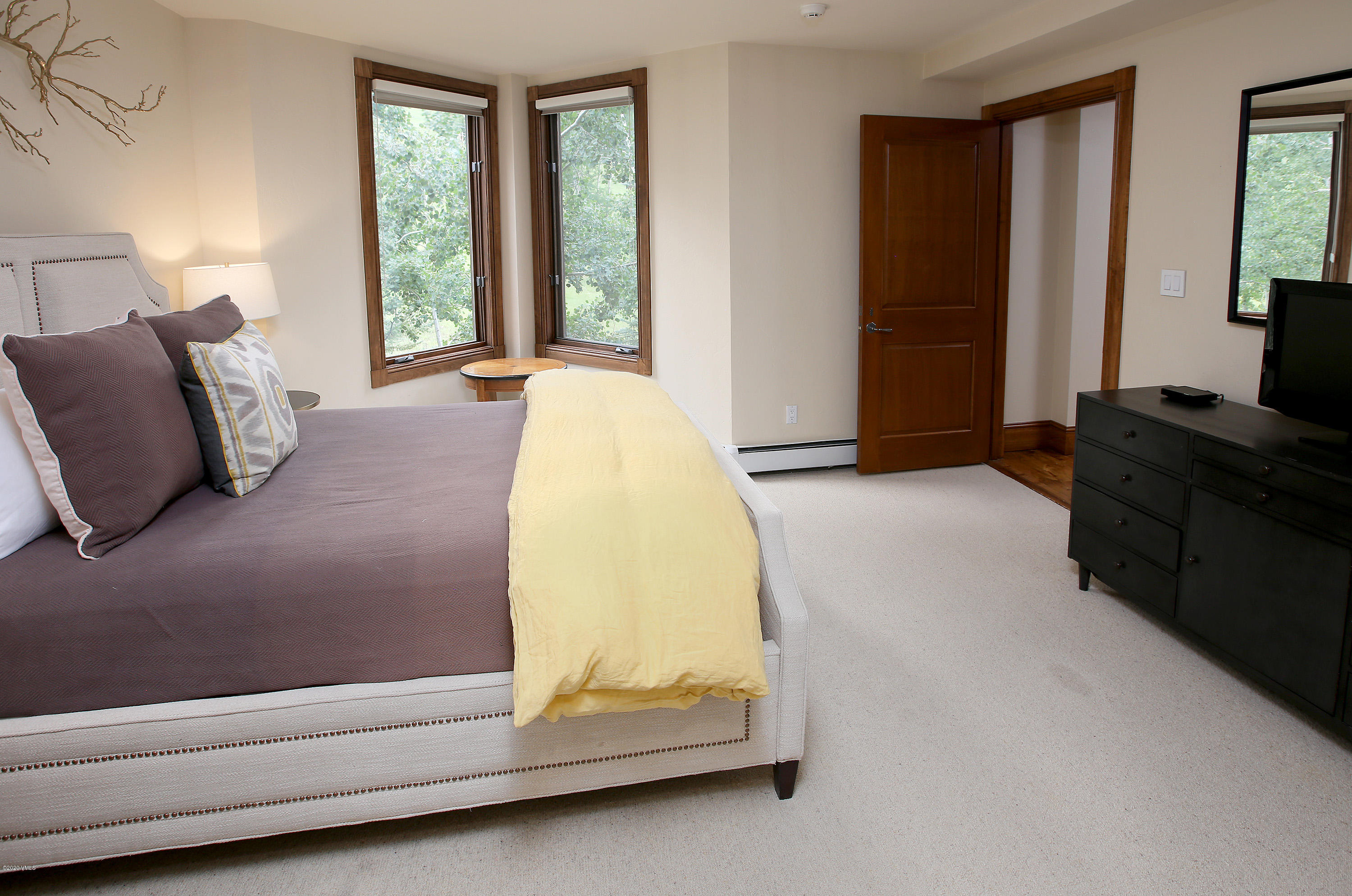 62 Highlands Lane, Unit R602 Beaver Creek, CO 81620 - Photo 16 of 30 a bedroom with a bed and window