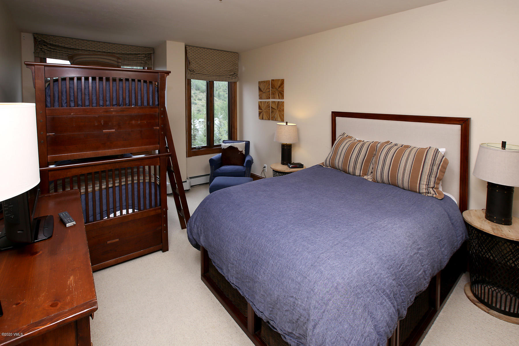 62 Highlands Lane, Unit R602 Beaver Creek, CO 81620 - Photo 18 of 30 a bedroom with a bed and wooden floor