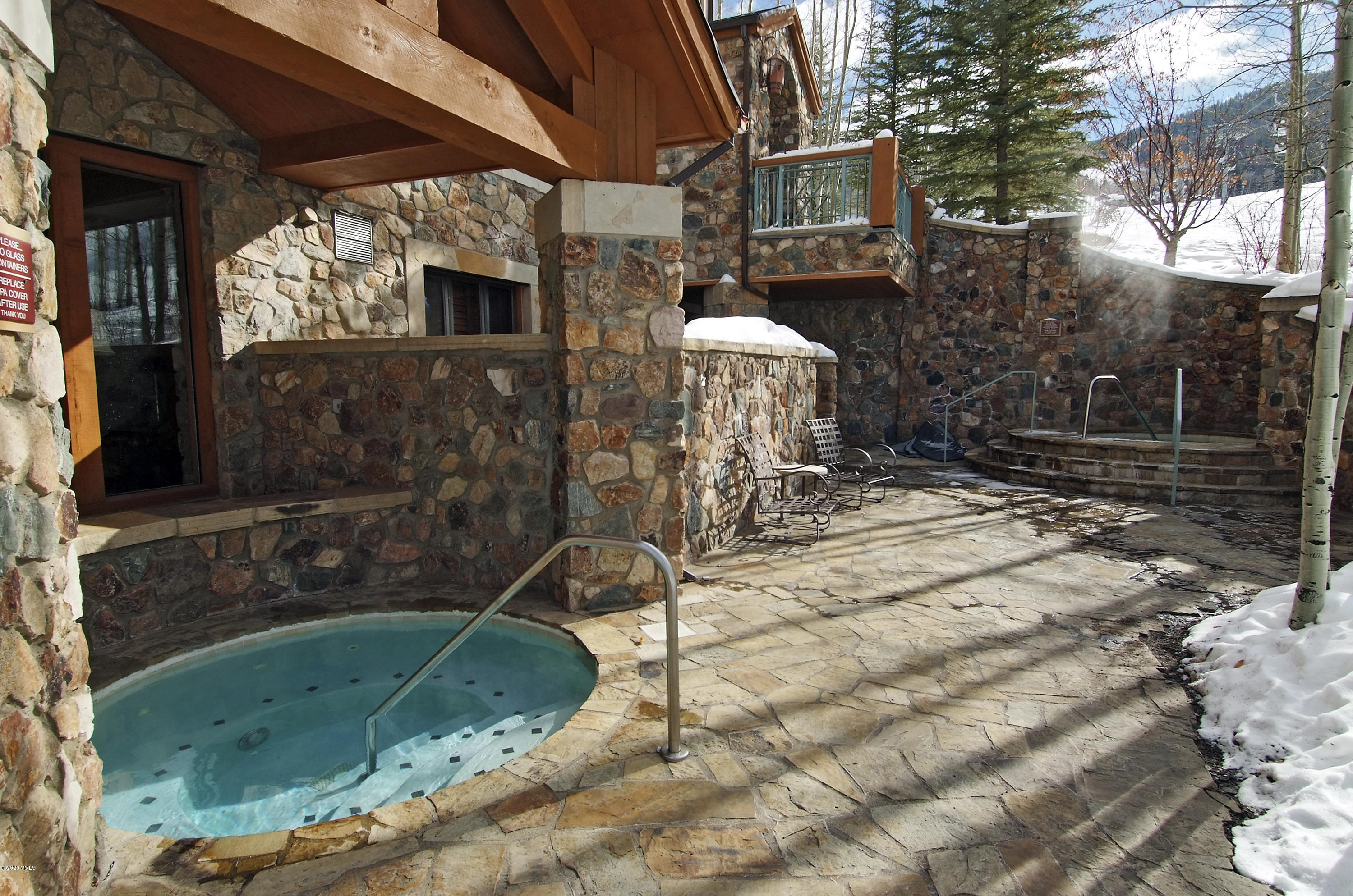 62 Highlands Lane, Unit R602 Beaver Creek, CO 81620 - Photo 29 of 30 a backyard of a house with barbeque oven