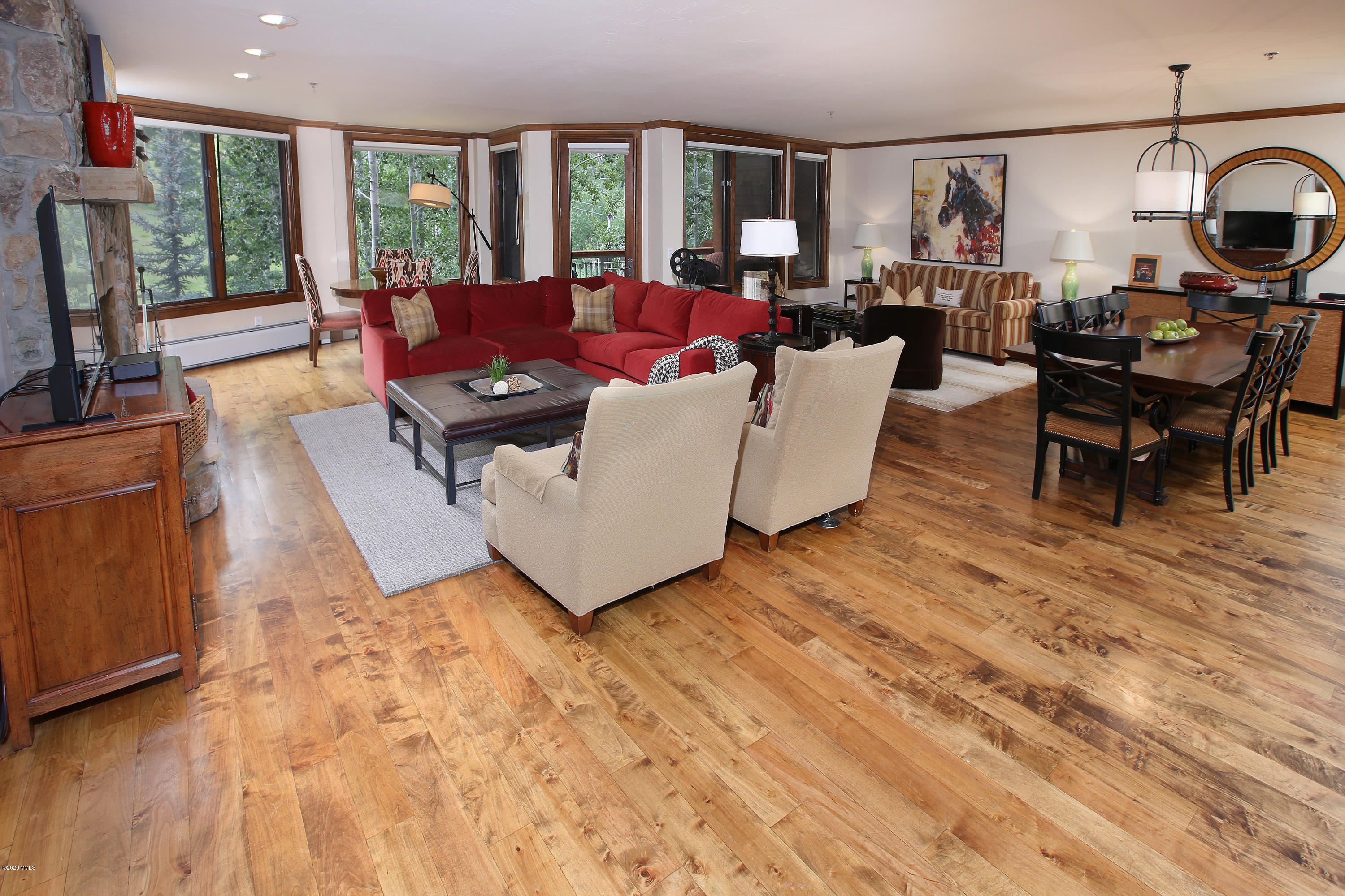62 Highlands Lane, Unit R602 Beaver Creek, CO 81620 - Photo 10 of 30 a living room with furniture a large window and dining table