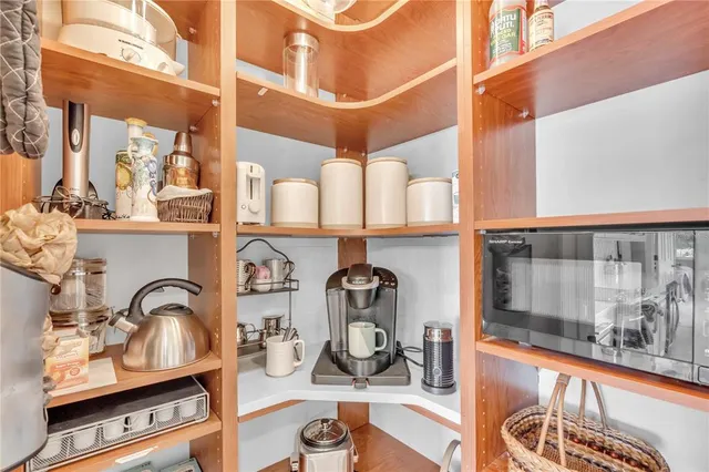 a view of storage and utility room with racks on the wall