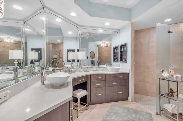 a large bathroom with a large tub and sink