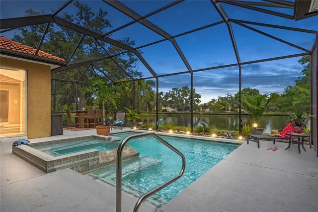 a view of a swimming pool with a patio