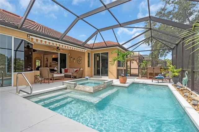 a view of a house with backyard porch and sitting area
