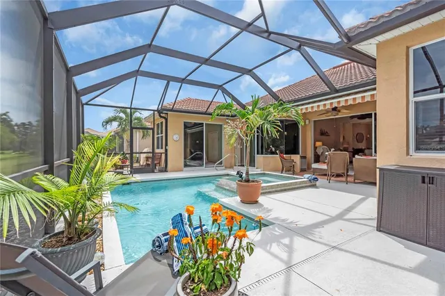 a view of a patio with table and chairs under an umbrella