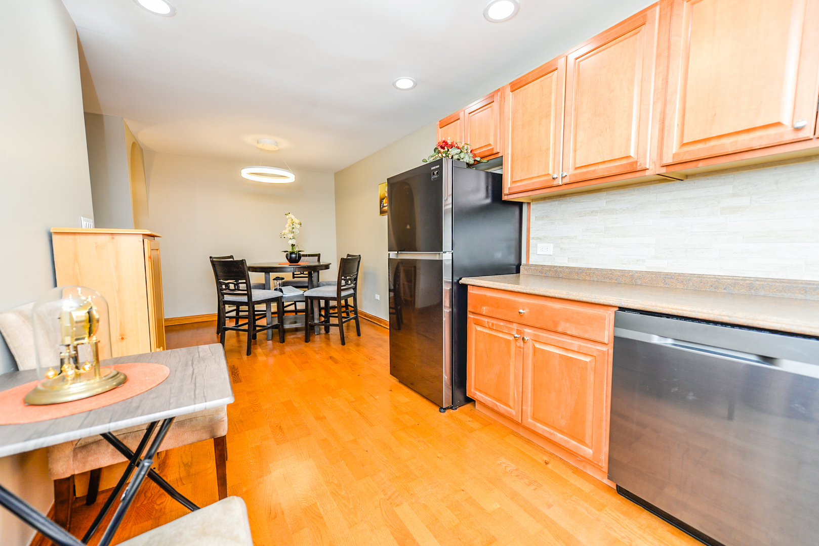 280 North Westgate Road, Unit 128 Mount Prospect, IL 60056 - Photo 11 of 29 a kitchen with stainless steel appliances granite countertop a refrigerator and a stove top oven