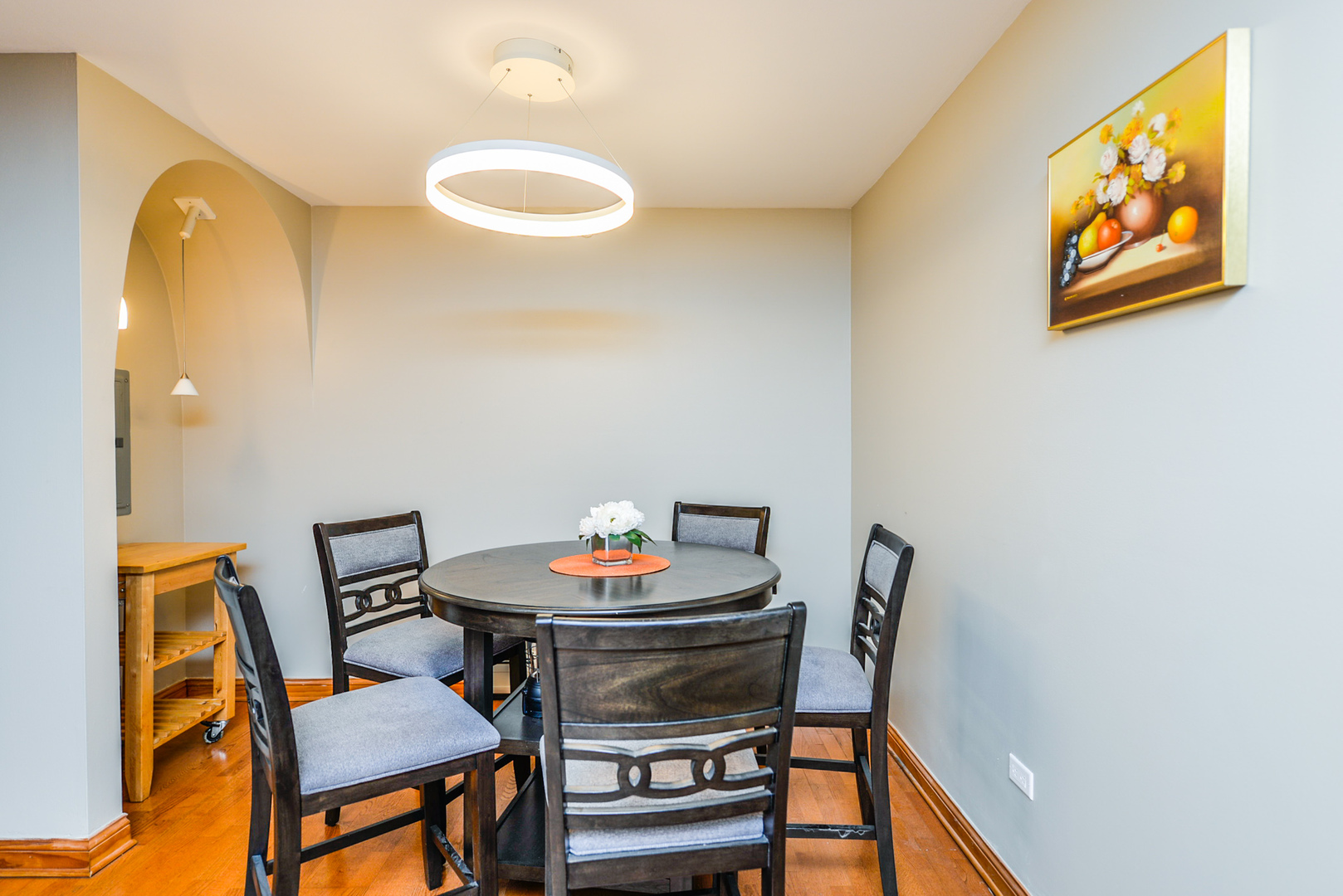 280 North Westgate Road, Unit 128 Mount Prospect, IL 60056 - Photo 12 of 29 a view of a dining room with furniture and wooden floor
