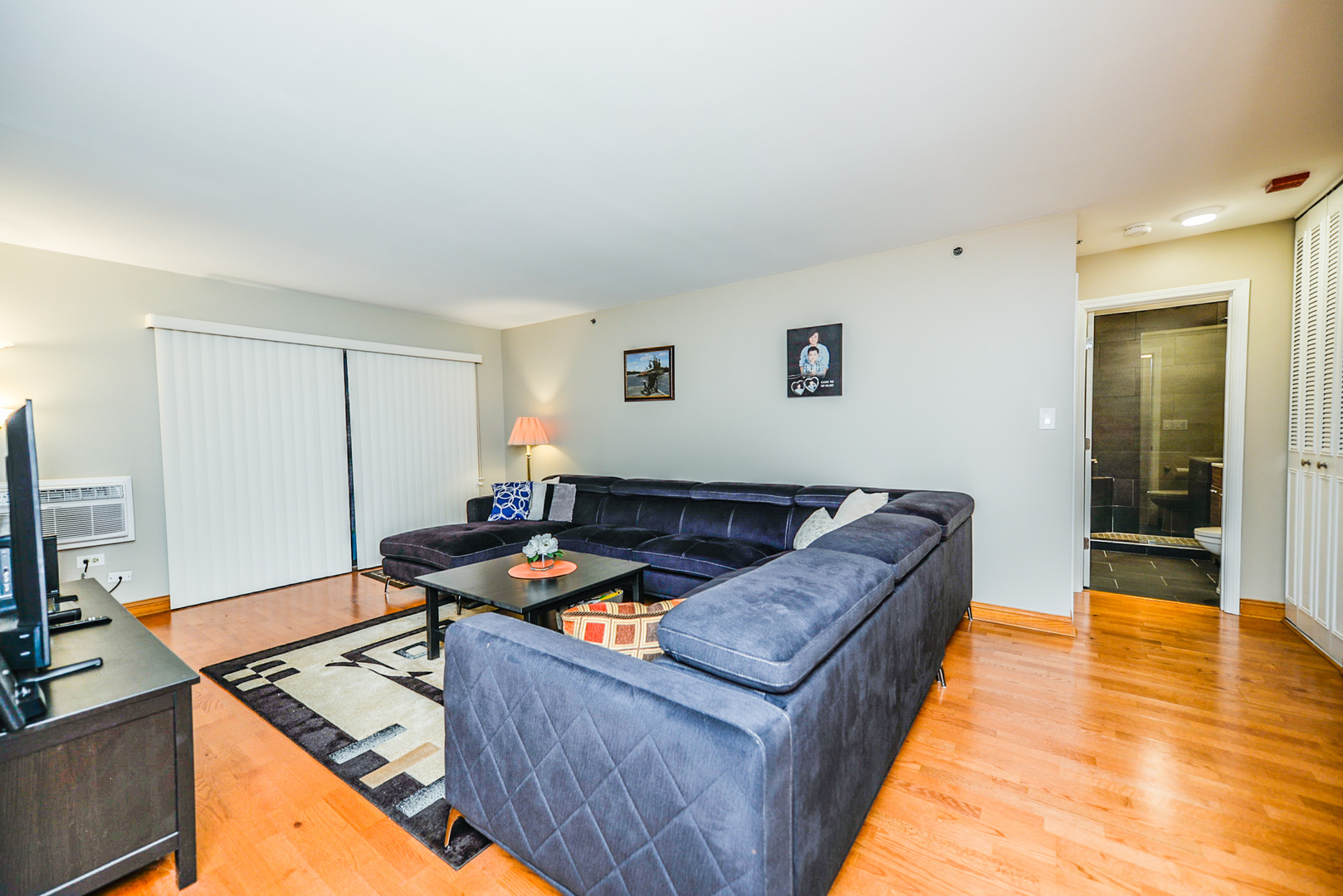 280 North Westgate Road, Unit 128 Mount Prospect, IL 60056 - Photo 15 of 29 a living room with furniture and a wooden floor