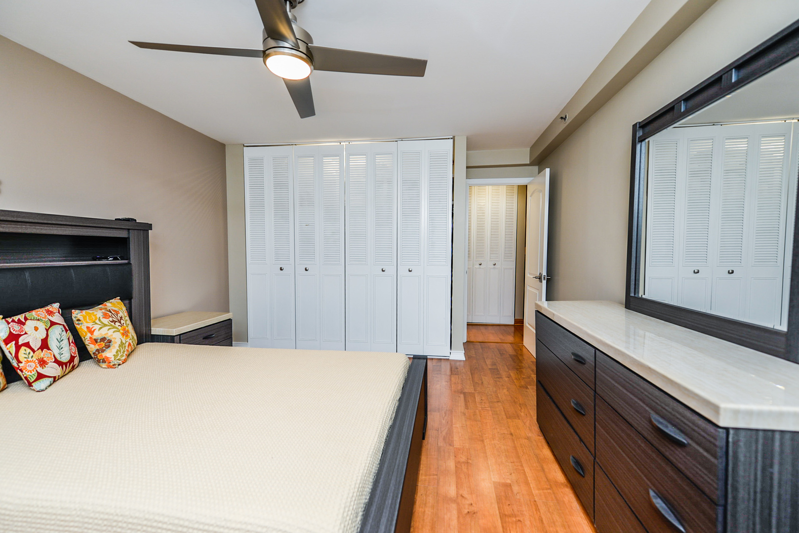 280 North Westgate Road, Unit 128 Mount Prospect, IL 60056 - Photo 19 of 29 a bedroom with a bed and wooden floor