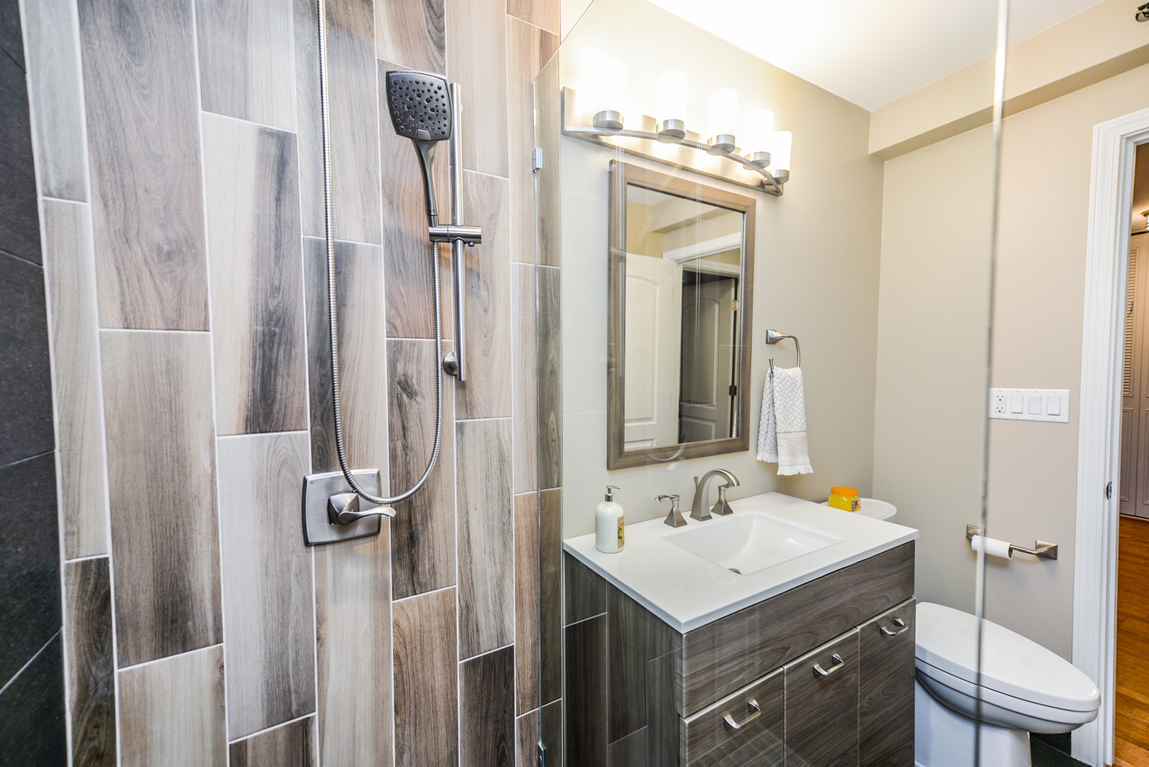 280 North Westgate Road, Unit 128 Mount Prospect, IL 60056 - Photo 21 of 29 a bathroom with a sink vanity toilet and shower