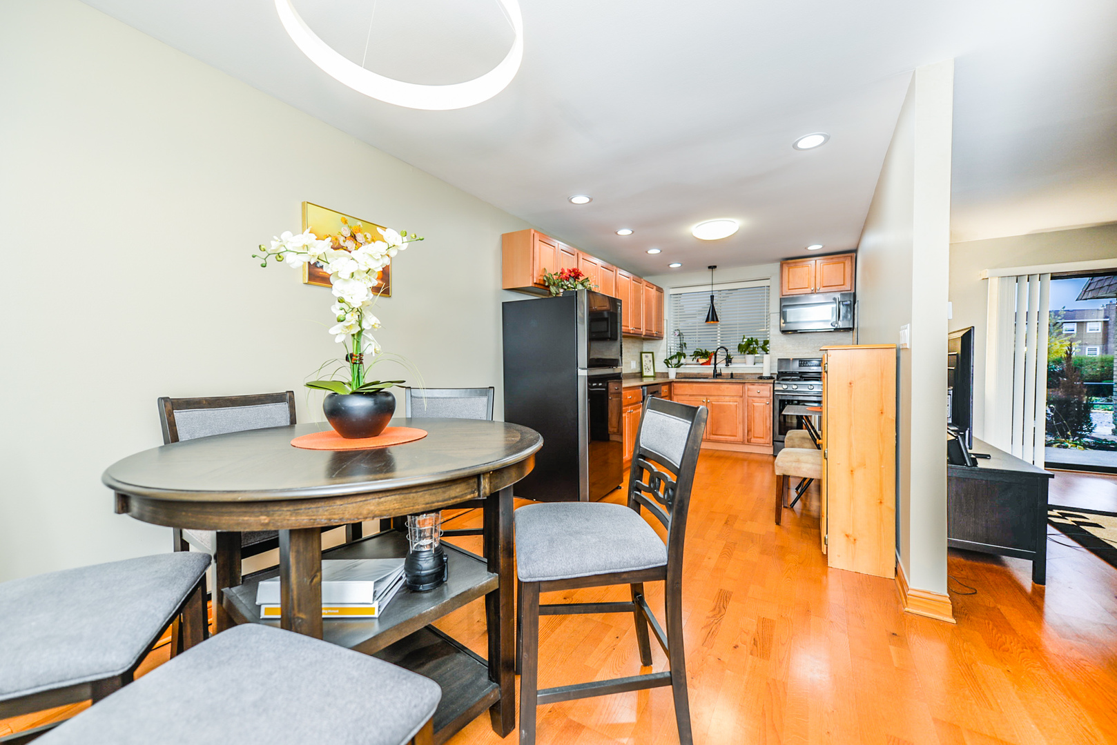 280 North Westgate Road, Unit 128 Mount Prospect, IL 60056 - Photo 4 of 29 a view of a dining room with furniture and wooden floor