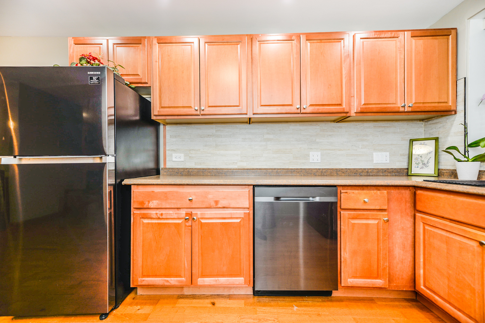 280 North Westgate Road, Unit 128 Mount Prospect, IL 60056 - Photo 8 of 29 a kitchen with stainless steel appliances granite countertop a refrigerator and a sink