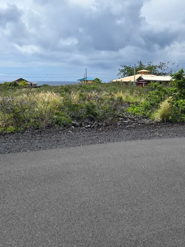 a view of a road with an ocean