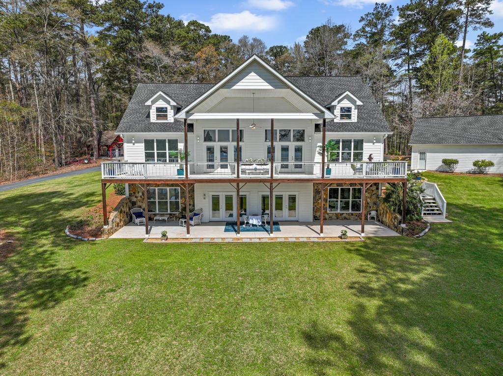 263 Old Hardy Farm Road Jackson, GA 30233 - Photo 3 of 29 a view of a swimming pool and lounge chairs in the patio