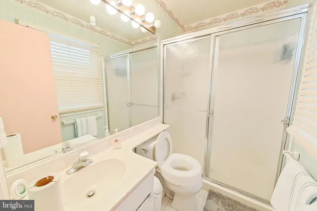 a bed room with a bed and a chair