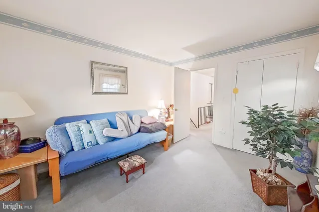 a living room with furniture toys and a window