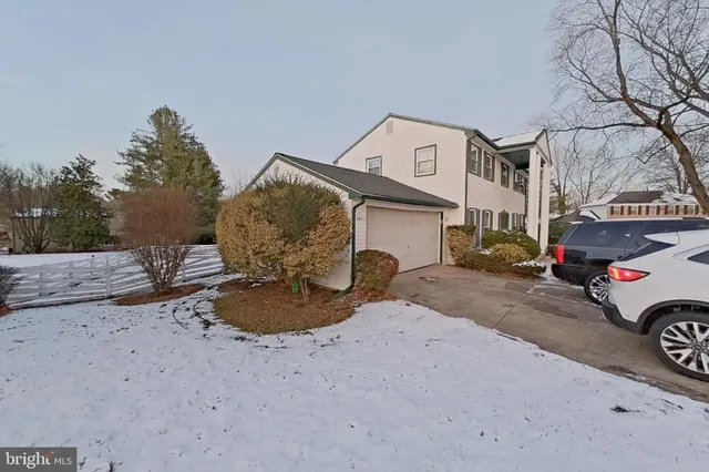 a view of a car park in front of a house