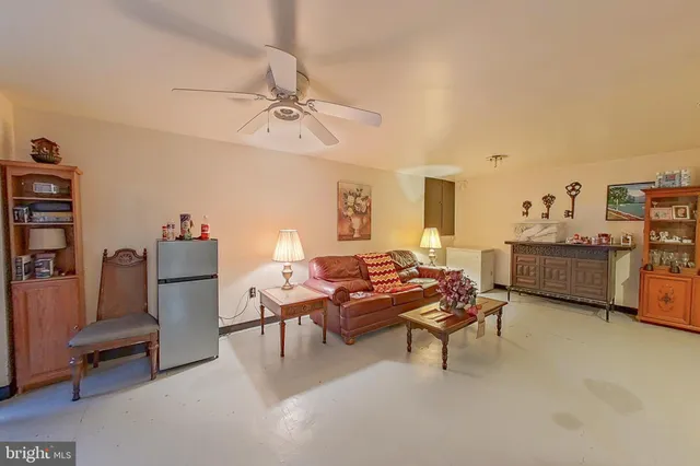 a bathroom with a toilet sink and a mirror