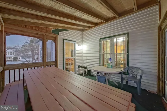 a view of a balcony with furniture