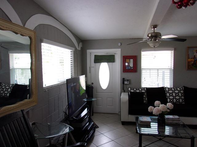 5588 South Rue Road West Palm Beach, FL 33415 - Photo 2 of 29 a living room with furniture a window and a chandelier