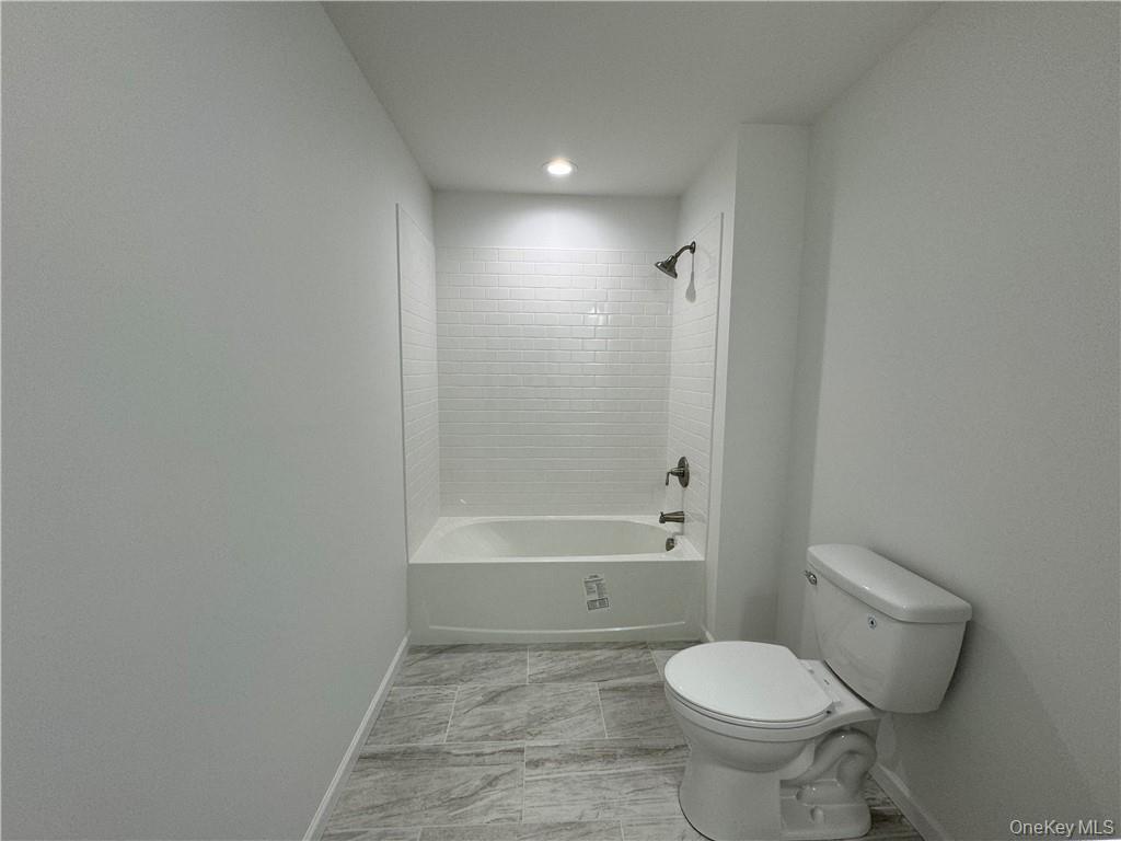 16 Pinto Road Middletown, NY 10941 - Photo 28 of 36 Bathroom with tiled shower / bath combo, tile patterned floors, and toilet