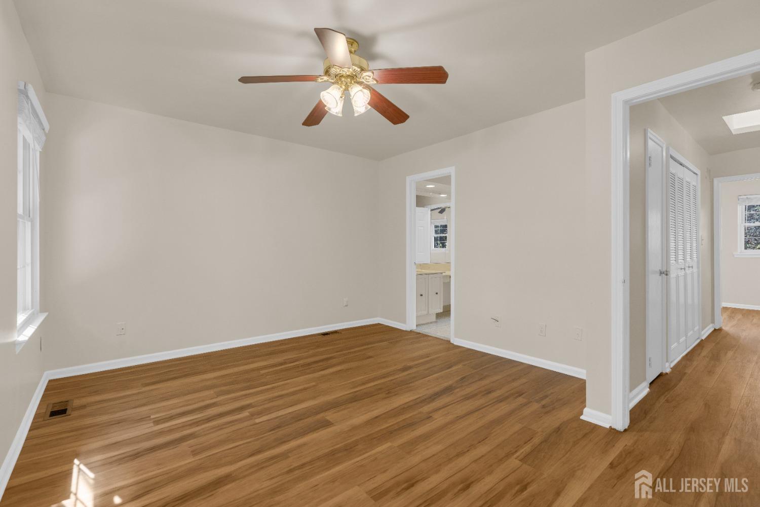 1405 Maplecrest Road Edison, NJ 08820 - Photo 21 of 33 a view of room with wooden floor and ceiling fan