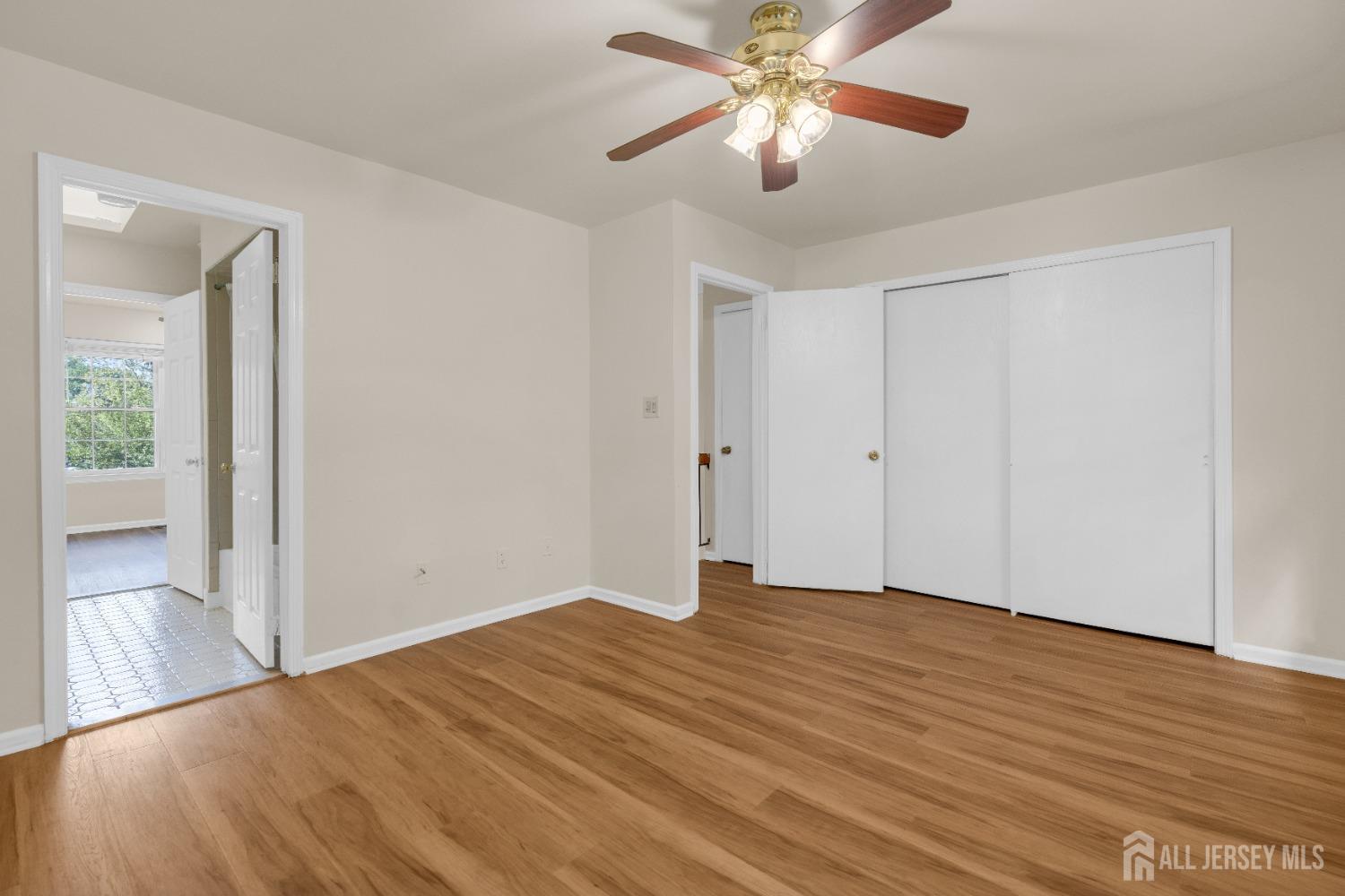 1405 Maplecrest Road Edison, NJ 08820 - Photo 23 of 33 a view of an empty room and wooden floor