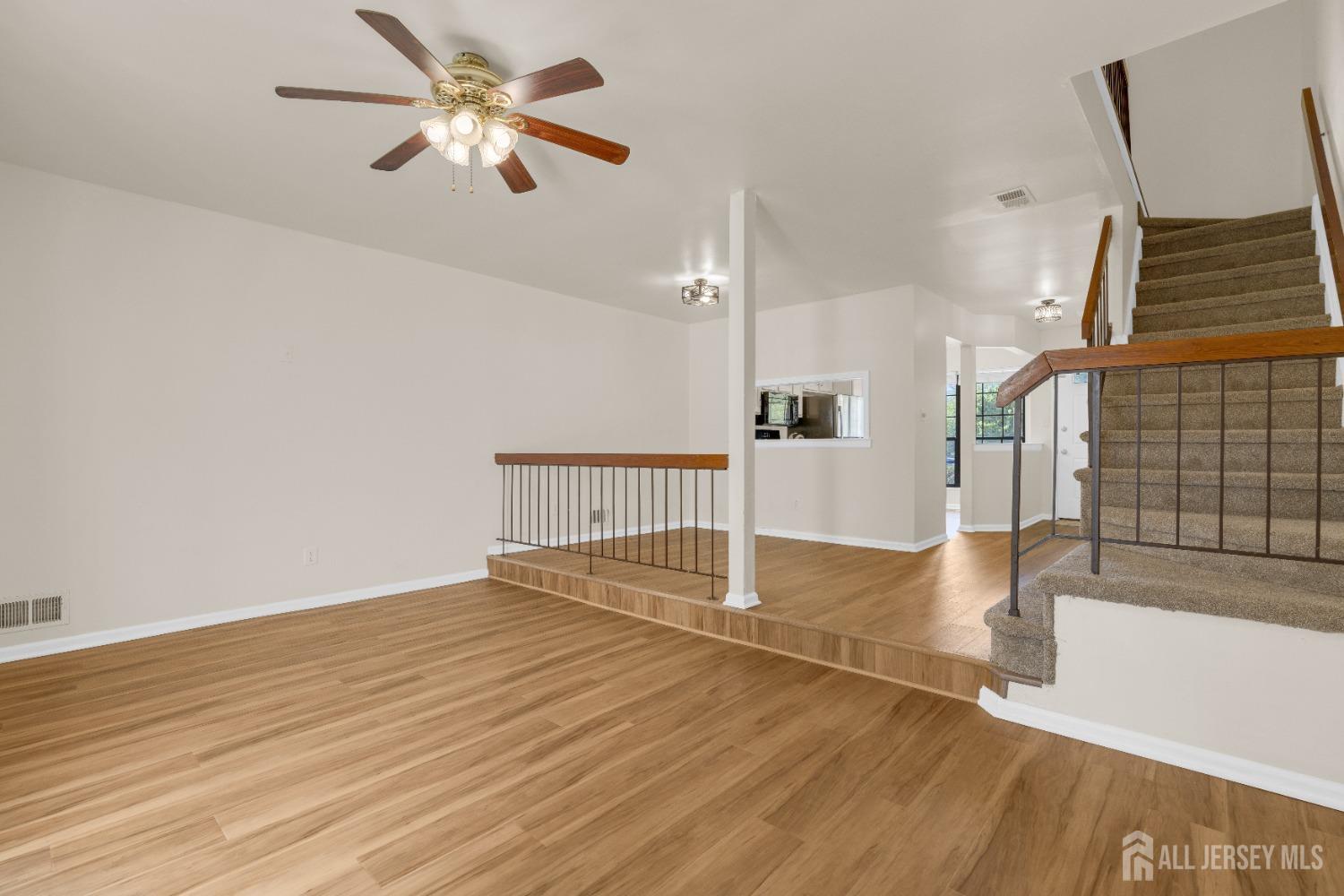 1405 Maplecrest Road Edison, NJ 08820 - Photo 8 of 33 a view of empty room with wooden floor