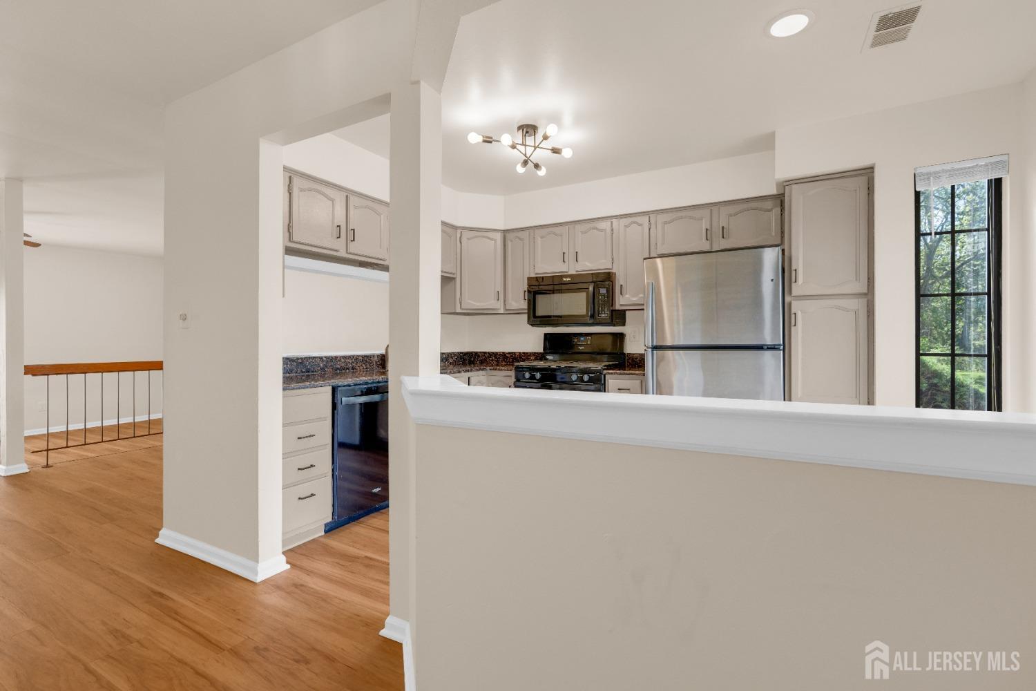 1405 Maplecrest Road Edison, NJ 08820 - Photo 10 of 33 a kitchen with a refrigerator and a stove top oven