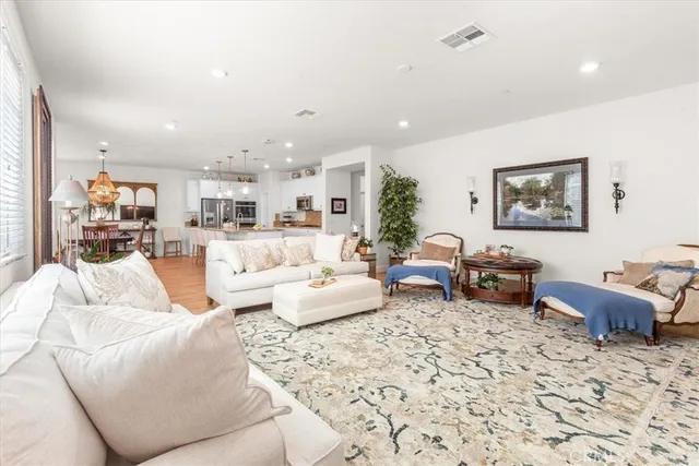 a living room with furniture or couch and a kitchen