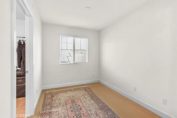 a view of a room with wooden floor and closet