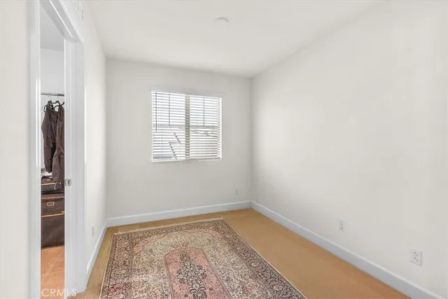 a view of a room with wooden floor and closet