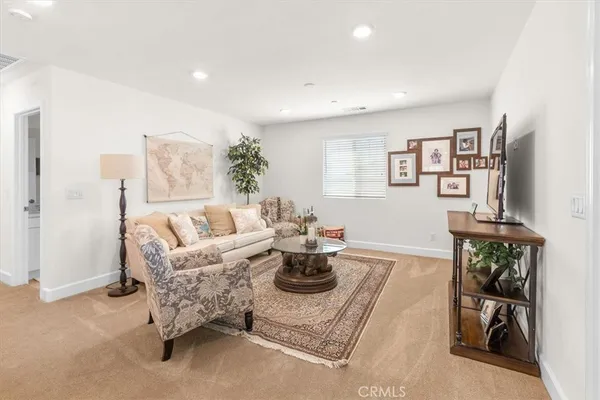 a living room with furniture and a table
