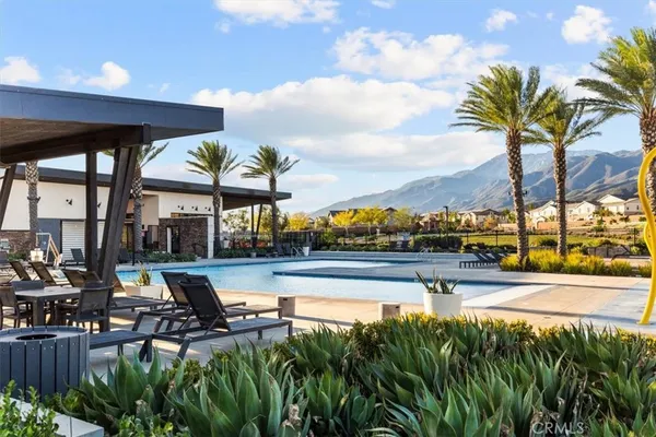 a view of yard with swimming pool and patio