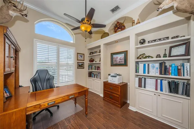 a bedroom with furniture and a book shelf