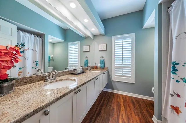 a bathroom with sinks granite countertop a sink and a large mirror