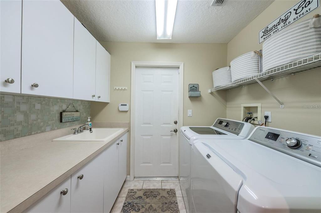 1203 Hagen Drive Trinity, FL 34655 - Photo 20 of 21 a room with storage and utility