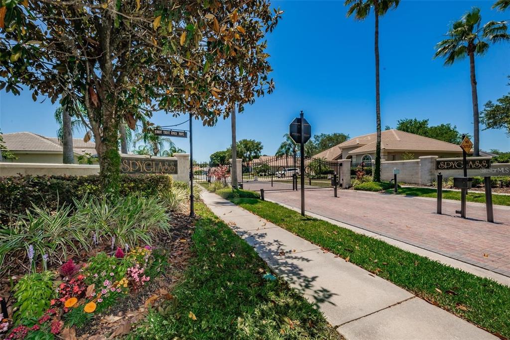 1203 Hagen Drive Trinity, FL 34655 - Photo 21 of 21 a view of a park with table and chairs under an umbrella