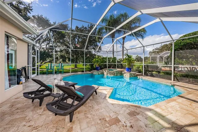 a view of a backyard with sitting area