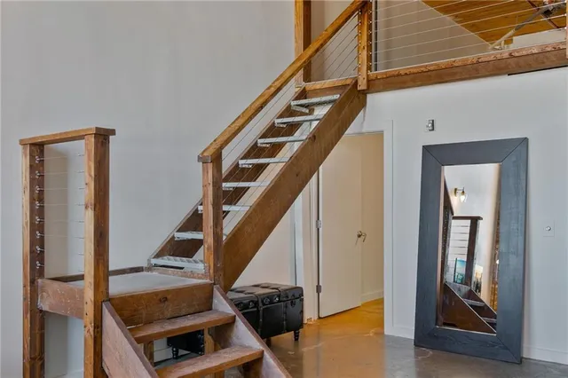 a view of an entryway with wooden floor